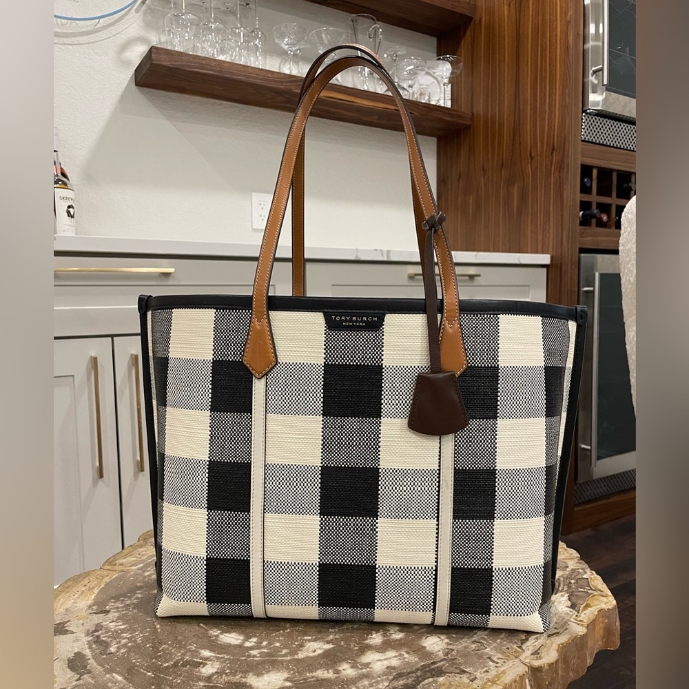 Tory Burch leather tote, black and white with brown leather straps.